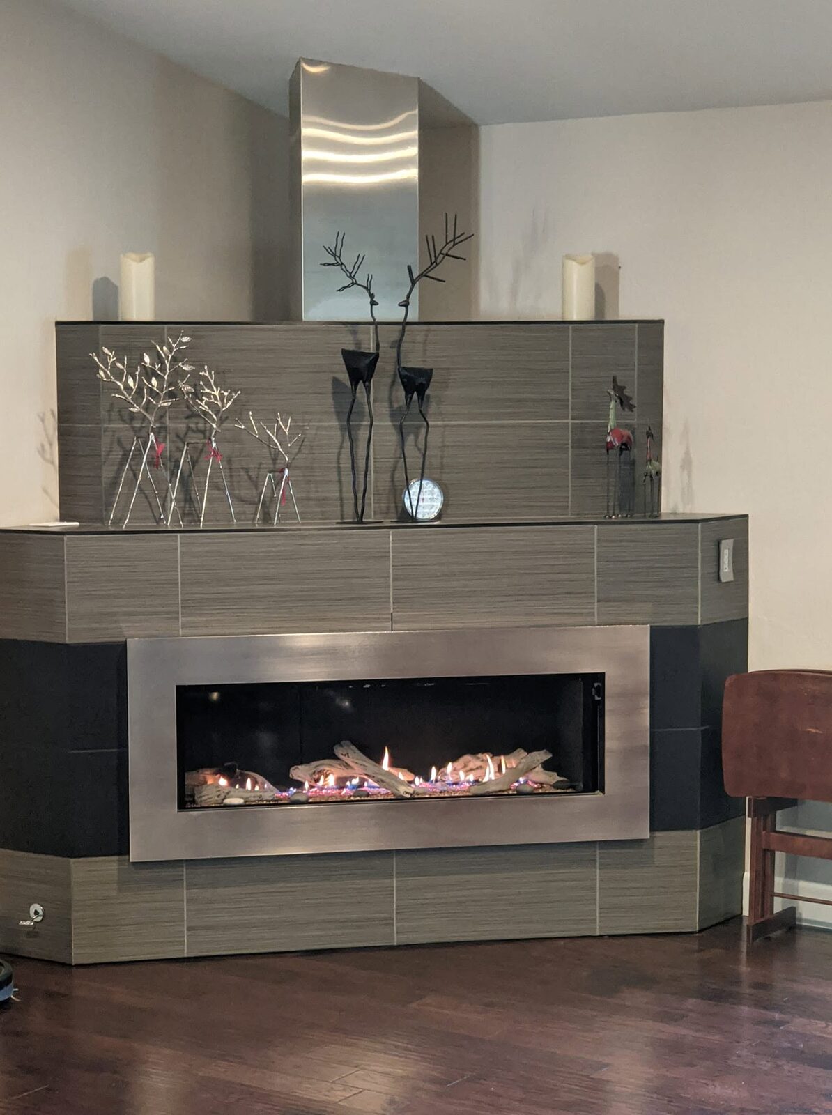 A modern fireplace with a stone surround in a Colorado home